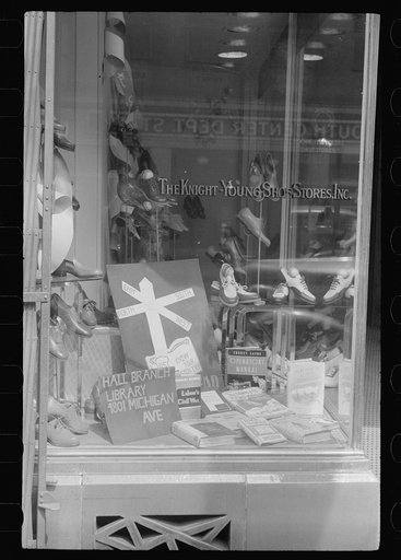 Untitled photo, possibly related to: Books on display in show store window, 47th Street, Chicago, Illinois
