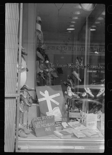 Untitled photo, possibly related to: Books on display in show store window, 47th Street, Chicago, Illinois