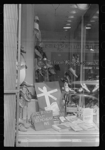 Untitled photo, possibly related to: Books on display in show store window, 47th Street, Chicago, Illinois