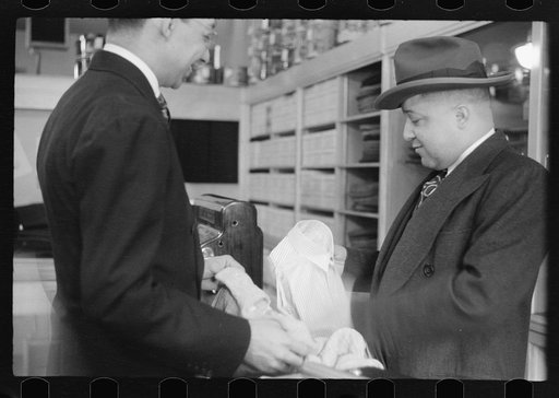 Untitled photo, possibly related to: Books on display in show store window, 47th Street, Chicago, Illinois