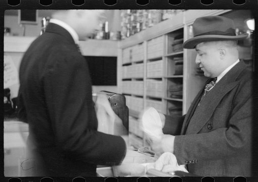 Untitled photo, possibly related to: Books on display in show store window, 47th Street, Chicago, Illinois