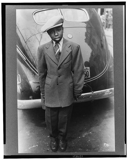 Adolescent boy dressed up for the Easter parade, Chicago, Illinois