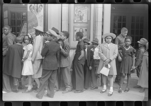 Untitled photo, possibly related to: Children in front of moving picture theater, Easter Sunday matinee, Black Belt, Chicago, Illinois