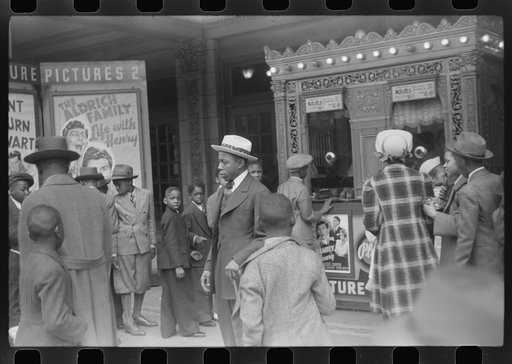 Untitled photo, possibly related to: Children in front of moving picture theater, Easter Sunday matinee, Black Belt, Chicago, Illinois