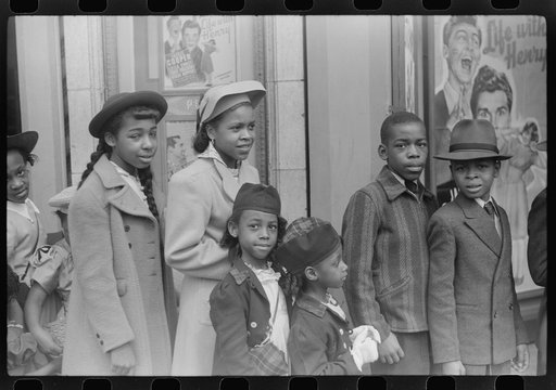 Children in front of moving picture theater, Easter Sunday matinee, Black Belt, Chicago, Illinois