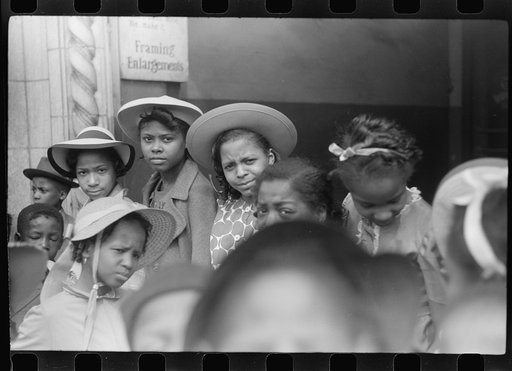 Untitled photo, possibly related to: Children in front of moving picture theater, Easter Sunday matinee, Black Belt, Chicago, Illinois