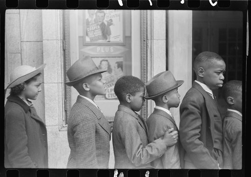 Children in front of moving picture theater, Easter Sunday matinee, Black Belt, Chicago, Illinois
