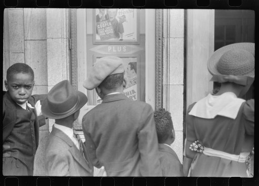 Untitled photo, possibly related to: Children in front of moving picture theater, Easter Sunday matinee, Black Belt, Chicago, Illinois