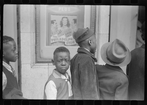 Children in front of moving picture theater, Easter Sunday matinee, Black Belt, Chicago, Illinois