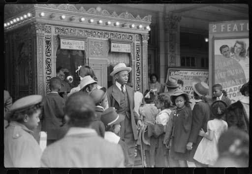 Children in front of moving picture theater, Easter Sunday matinee, Black Belt, Chicago, Illinois