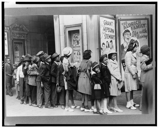 Children in front of moving picture theater, Easter Sunday matinee, Black Belt, Chicago, Illinois