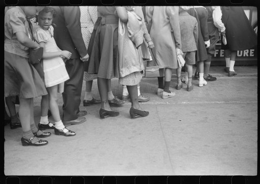 Untitled photo, possibly related to: Children in front of moving picture theater, Easter Sunday matinee, Black Belt, Chicago, Illinois