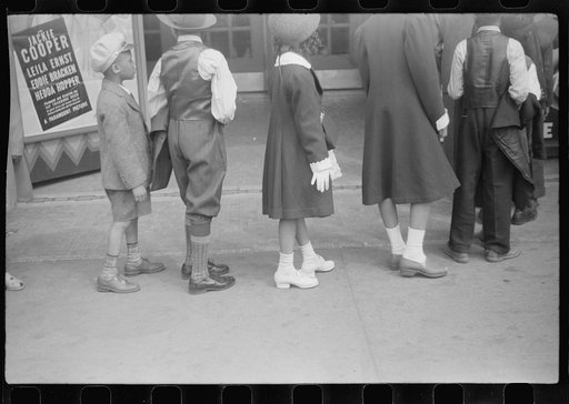 Untitled photo, possibly related to: Children in front of moving picture theater, Easter Sunday matinee, Black Belt, Chicago, Illinois