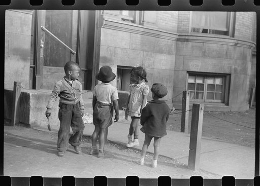 Untitled photo, possibly related to: Children in front of apartment buildings in one of the better neighborhoods in the Black Belt, Chicago, Illinois