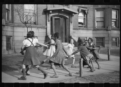 Untitled photo, possibly related to: Children playing "ring around a rosie" in one of the better neighborhoods of the Black Belt, Chicago, Illinois