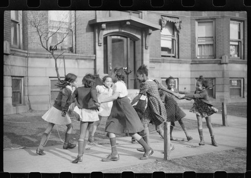 Untitled photo, possibly related to: Children playing "ring around a rosie" in one of the better neighborhoods of the Black Belt, Chicago, Illinois