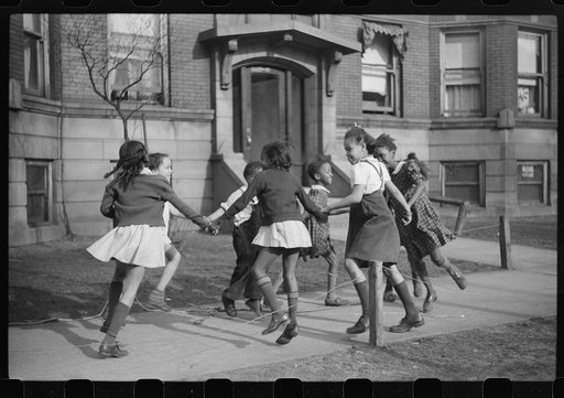 Untitled photo, possibly related to: Children playing "ring around a rosie" in one of the better neighborhoods of the Black Belt, Chicago, Illinois
