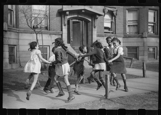Children playing "ring around a rosie" in one of the better neighborhoods of the Black Belt, Chicago, Illinois