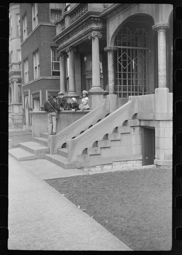 Untitled photo, possibly related to: Children in front of apartment buildings in the better section of the Black Belt, Chicago, Illinois