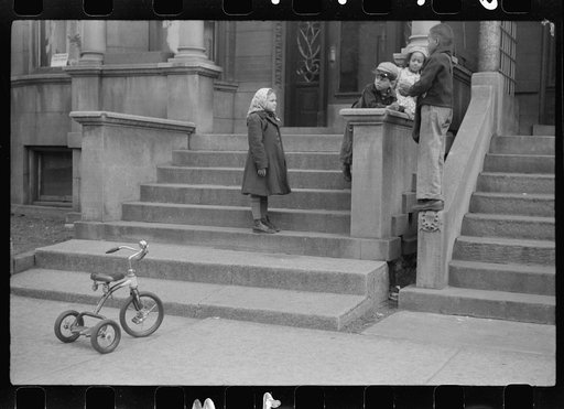 Untitled photo, possibly related to: Children in front of apartment buildings in the better section of the Black Belt, Chicago, Illinois
