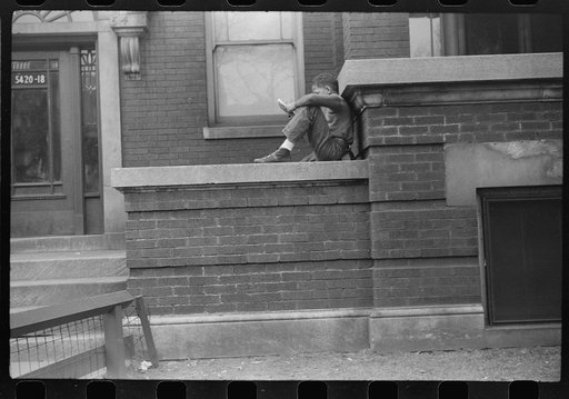 Untitled photo, possibly related to: Child in front of apartment building in the better section of the Black Belt, Chicago, Illinois