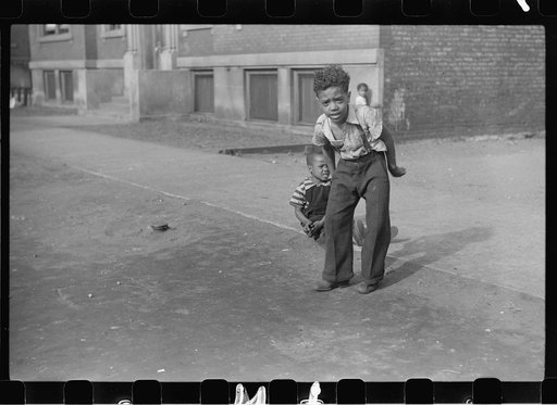 Untitled photo, possibly related to: Children playing on the street, Chicago, Illinois