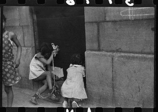 Untitled photo, possibly related to: Children playing on the street, Chicago, Illinois