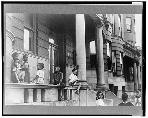 Children in front of apartment buildings in the better section of the Black Belt, Chicago, Illinois