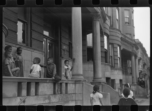 Untitled photo, possibly related to: Children in front of apartment buildings in the better section of the Black Belt, Chicago, Illinois