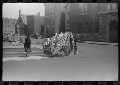 Untitled photo, possibly related to: Negro man and woman collecting paper and trask for sale. This is a common occupation for the unemployed in the Black Belt. Chicago, Illinois