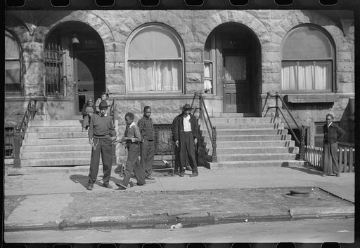 Young people in apartment section recently taken over from white population, Chicago, Illinois