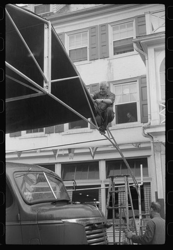 Untitled photo, possibly related to: Preparations for fireman's carnival, July 4th celebration, State College, Pennsylvania