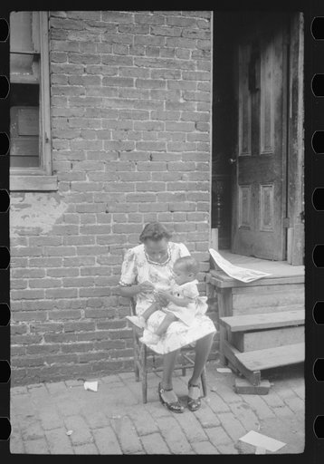 Untitled photo, possibly related to: Mother and child. Alley dwelling area. Washington, D.C.