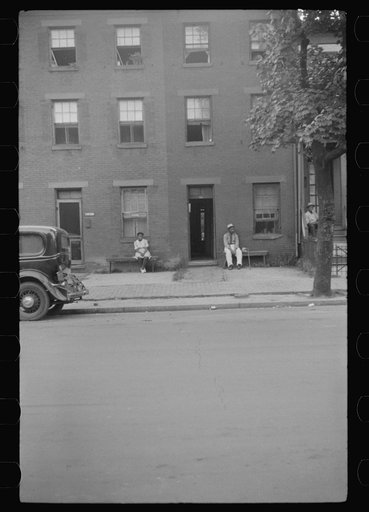 Untitled photo, possibly related to: Negroes and their home in the alley dwelling area. Note: building next door is gutted. Washington, D.C.