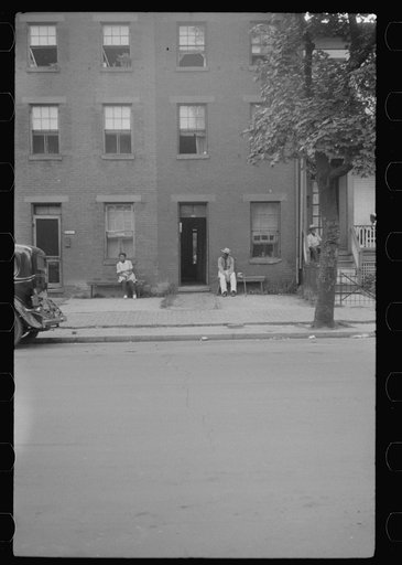 Untitled photo, possibly related to: Negroes and their home in the alley dwelling area. Note: building next door is gutted. Washington, D.C.