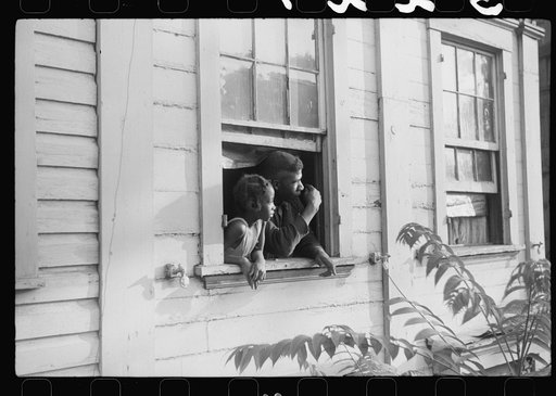Untitled photo, possibly related to: Negroes looking out of their home, Washington, D.C.