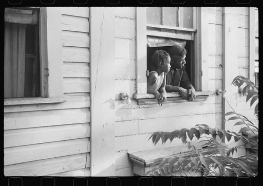 Negroes looking out of their home, Washington, D.C.