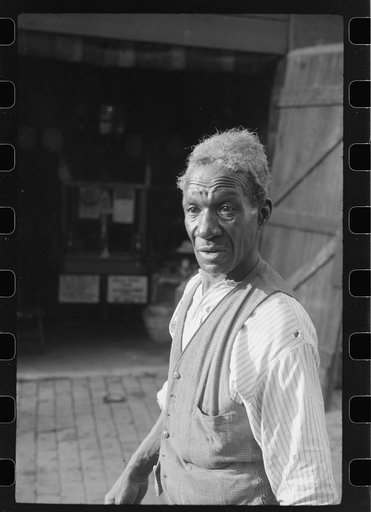 Untitled photo, possibly related to: Travelling evangelist, alley dwelling section, Washington, D.C.