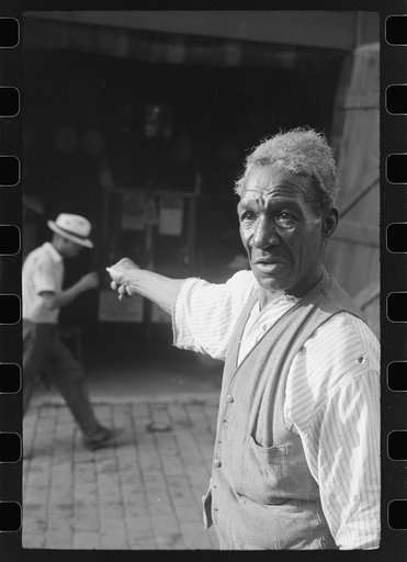 Untitled photo, possibly related to: Travelling evangelist, alley dwelling section, Washington, D.C.