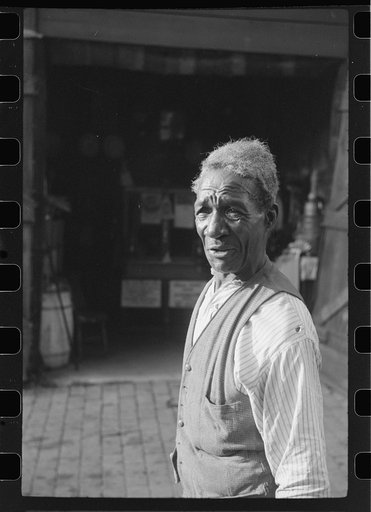 Untitled photo, possibly related to: Travelling evangelist, alley dwelling section, Washington, D.C.
