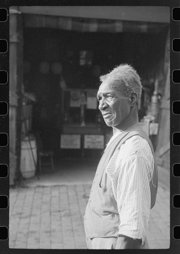 Untitled photo, possibly related to: Travelling evangelist, alley dwelling section, Washington, D.C.