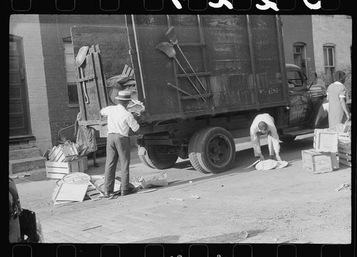 Negroes unloading crates and boxes to be used for firewood, alley dwelling area, Washington, D.C.