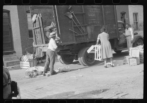 Negroes unloading crates and boxes to be used for firewood, alley dwelling area, Washington, D.C.