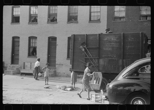 Untitled photo, possibly related to: Negroes unloading crates and boxes to be used for firewood, alley dwelling area, Washington, D.C.