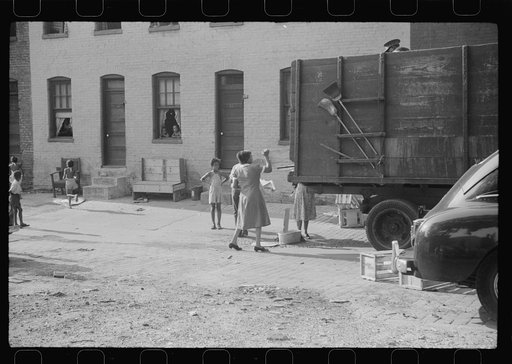 Untitled photo, possibly related to: Negroes unloading crates and boxes to be used for firewood, alley dwelling area, Washington, D.C.