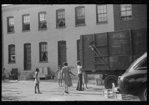 Untitled photo, possibly related to: Negroes unloading crates and boxes to be used for firewood, alley dwelling area, Washington, D.C.
