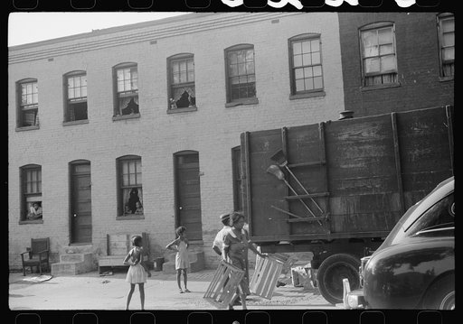 Untitled photo, possibly related to: Negroes unloading crates and boxes to be used for firewood, alley dwelling area, Washington, D.C.