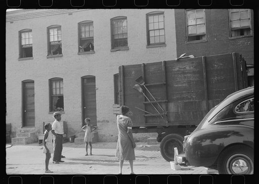 Untitled photo, possibly related to: Negroes unloading crates and boxes to be used for firewood, alley dwelling area, Washington, D.C.