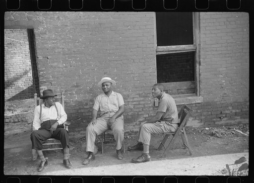 Negroes in front of their homes in the alley dwelling area. Washington, D.C.