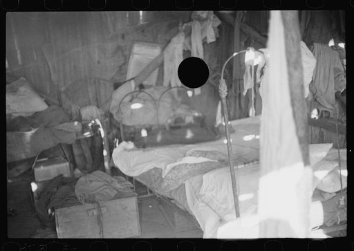 Untitled photo, possibly related to: Stove made out of old oil can, squatter's camp, Arkansas